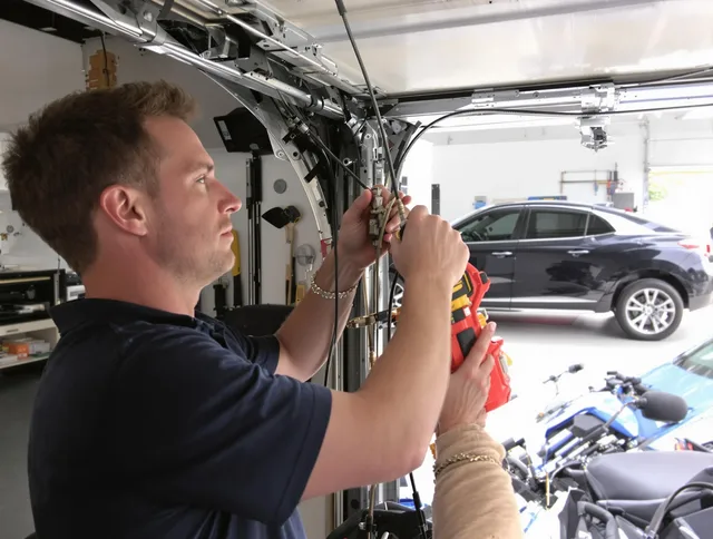 Bristol Garage Door Repair safety certified technician performing cable replacement in Bristol