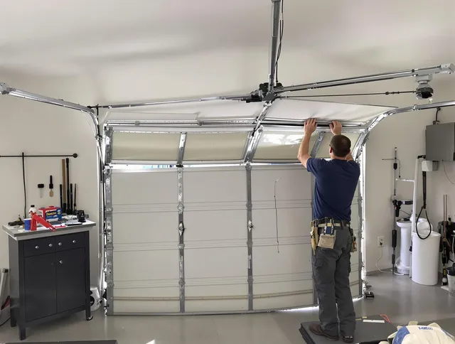 Bristol Garage Door Repair specialist performing precise section replacement on Bristol garage door